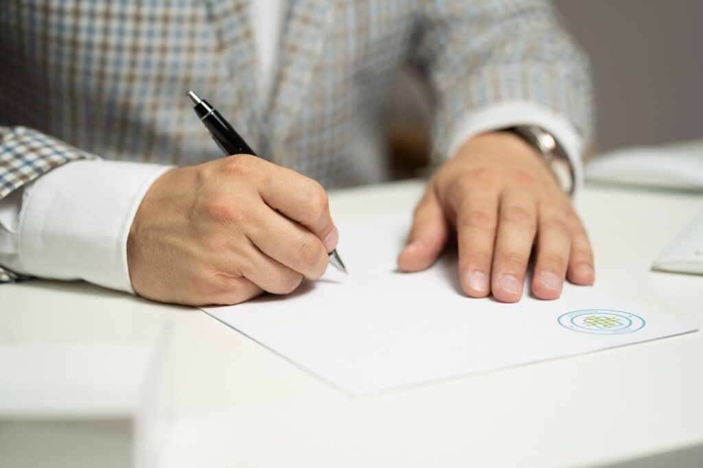 A person signing foreclosure documents.