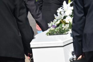 Inheritors carrying a casket